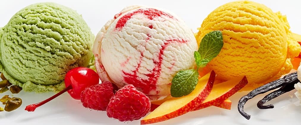 colorful balls of ice cream laid out in a row